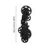 A black mechanical clock with gears, shown vertically against a white background. Voir les images du produit