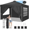 A woman is leaning against a black pop-up tent with windows. Accessories for the tent are laid out in the foreground. Voir les images du produit