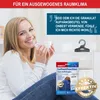 A woman sitting on a couch holding a mug, with product packaging and a product hanging in the background. Produktbild-Vorschau