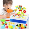 A young boy is playing with a construction toy set, using an electric drill to assemble a robot. Produktbild-Vorschau