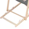 A close-up view of the wooden frame and fabric of a deck chair. Produktbild-Vorschau