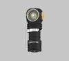 A black Armytek flashlight with a silver clip and yellow accents, set against a plain gray background. Produktbild-Vorschau