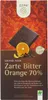 A chocolate bar wrapper with an image of a chocolate bar, an orange slice, and cocoa beans. Produktbild-Vorschau