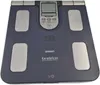 A blue Omron KaradaScan body composition monitor scale is shown from a top-down perspective against a light gray background. Podgląd zdjęcia produktu