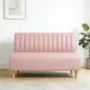 A pink sofa in a room with a framed picture on the wall and a plant. Anteprima dell’immagine prodotto