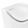 A close-up, angled view of the top of a white Linksys Velop Pro 6E mesh WiFi system, showing the brand logo and ventilation slots. Produktbild-Vorschau