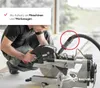 A person is using a miter saw with a vacuum adapter attached. Produktbild-Vorschau