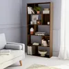 A bookshelf filled with books and decorative items in a room with a sofa. Produktbild-Vorschau