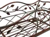 A close-up view of a decorative metal plant stand with bird and leaf motifs. Anteprima dell’immagine prodotto