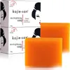 Two bars of Kojie San skin brightening soap are shown next to their packaging. Anteprima dell’immagine prodotto