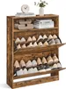 A vintage-style shoe cabinet with two flip-down doors, filled with shoes. Produktbild-Vorschau