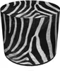 A cylindrical pouf with a zebra print pattern. Produktbild-Vorschau