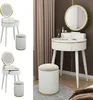 A collage of a white vanity table with a round LED mirror and a matching stool, shown from different angles and in a room setting. Podgląd zdjęcia produktu