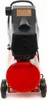 A red air compressor with a black motor housing and wheels, shown from the back. Náhľad obrázku produktu