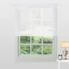 A white sheer curtain is hung on a window, with greenery visible outside. A lamp and an alarm clock are placed on a small table to the right. Anteprima dell’immagine prodotto