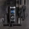 A Nivea Men Active Clean shower gel bottle is displayed with charcoal pieces and grooming accessories. Podgląd zdjęcia produktu