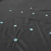 A black pool cover with scattered light blue dots. Podgląd zdjęcia produktu