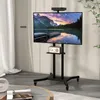 A TV stand with a TV mounted on it, placed in a room with curtains and a rug. Náhled obrázku produktu