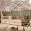 A child's bedroom with a wooden house-shaped bed and floral wallpaper. Náhľad obrázku produktu