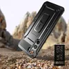 A rugged phone case is shown in a desert-like environment, with rocks and sand. Produktbild-Vorschau