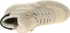 A close-up, top-down view of a beige women's boot with a fluffy lining. Voir les images du produit