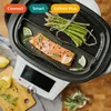 A piece of salmon and asparagus being steamed in a cooking device. Náhľad obrázku produktu