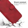 A red phone case is shown falling onto a cracked surface, illustrating its shock-resistant feature. Produktbild-Vorschau