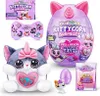 A collection of Rainbocorns Kittycorn Surprise toys, including a plush toy, a surprise egg, and smaller collectible figures, displayed against a white background. Produktbild-Vorschau