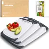 A set of three cutting boards with tomatoes and avocado slices on one of them, along with a box and a cookbook. Anteprima dell’immagine prodotto