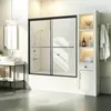 A modern bathroom with a bathtub shower door, vanity, and shelving unit. Anteprima dell’immagine prodotto