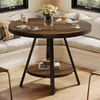 A round dining table set in a cozy corner with a window seat. Produktbild-Vorschau