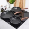 Three frying pans of different sizes are arranged on a black induction stovetop. Náhled obrázku produktu