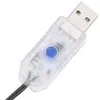 A close-up shot of a USB connector with a blue button and a black cable. Produktbild-Vorschau
