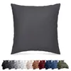 A large pillow in the foreground and a row of bedding sets in different colors in the background. Produktbild-Vorschau