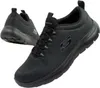 A pair of black Skechers sneakers shown from a diagonal angle against a white background. Voir les images du produit