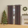 A Christmas-themed living room scene with a decorated tree, presents, plaid curtains, and a fireplace. Produktbild-Vorschau