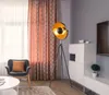 A living room scene with a floor lamp, chair, and cabinet. Anteprima dell’immagine prodotto