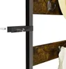 Close-up view of a wall-mounted coat rack with hooks and wooden shelves, showing mounting hardware. Podgląd zdjęcia produktu