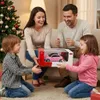 A family is gathered around a Christmas tree, with the parents presenting a pink toy car to their children. Náhled obrázku produktu