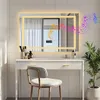 A modern bathroom vanity with a large LED mirror, a chair, and a plant. Náhľad obrázku produktu