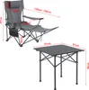 A camping chair and table set with dimensions indicated by red lines and text. Náhled obrázku produktu