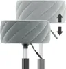 A close-up view of a gray stool, showing its height adjustment mechanism and quilted upholstery. Arrows indicate the direction of height adjustment. Produktbild-Vorschau