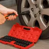 A person is using a socket wrench to tighten a lug nut on a car wheel, with a red toolbox containing sockets in the foreground. Anteprima dell’immagine prodotto