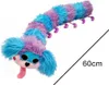 A plush toy caterpillar with blue and purple segments, a blue face with black eyes, pink cheeks, and a pink tongue sticking out. Produktbild-Vorschau