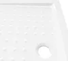 A close-up, angled view of a white shower tray with a textured, anti-slip surface and a drain hole. Produktbild-Vorschau
