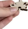 A hand holding a wooden puzzle piece. Náhľad obrázku produktu