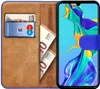 A wallet-style phone case for a Huawei P30 Lite, open to reveal card slots and banknotes, with the phone inside. Produktbild-Vorschau