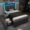 A modern bedroom with a bed featuring LED lighting and storage drawers. Produktbild-Vorschau