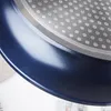A close-up view of the bottom edge and interior of a blue frying pan, showing its textured surface and metallic rim. Produktbild-Vorschau