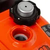 A close-up view of the fuel cap and opening of an orange engine. Produktbild-Vorschau